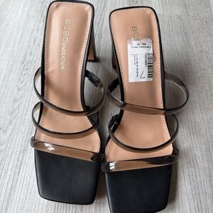 BCBGeneration Black Mule Heels Clear Strap
Square Toe New With Tag